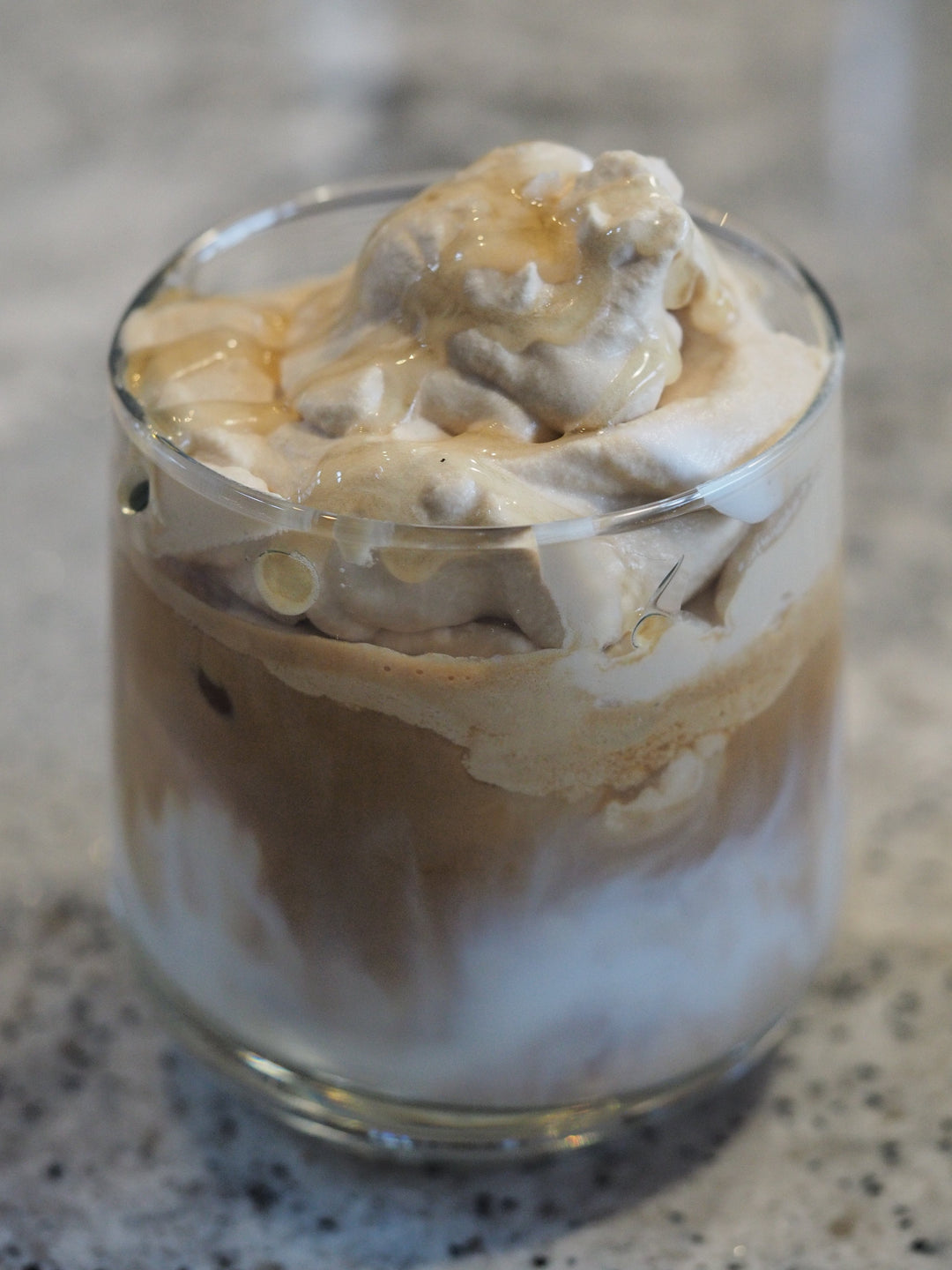 Cup of honey whipped coffee bee mafia raw honey