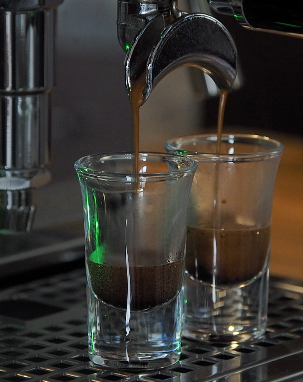 Espresso poured out of machine for Bee Mafia Honey Coffee