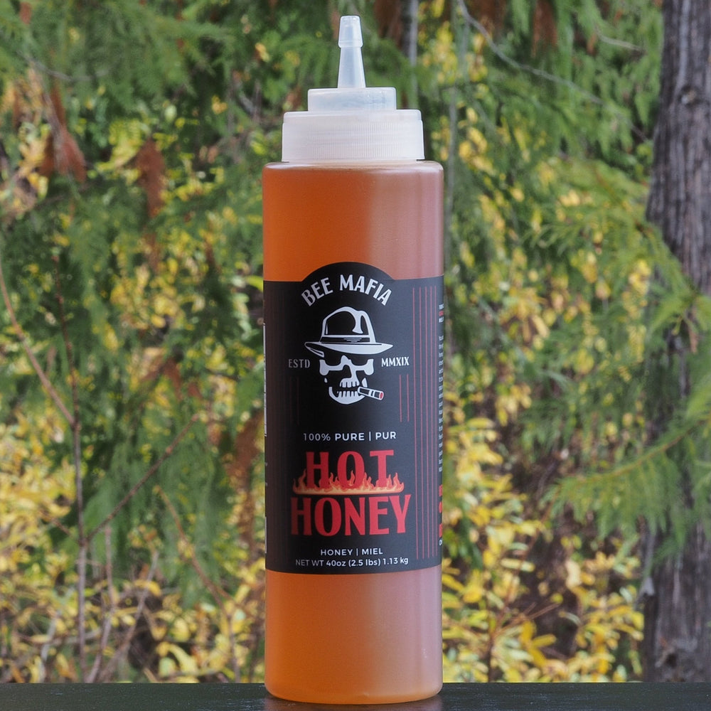 Large chef bottle of Bee Mafia Hot Honey in a a 40 oz bottle 