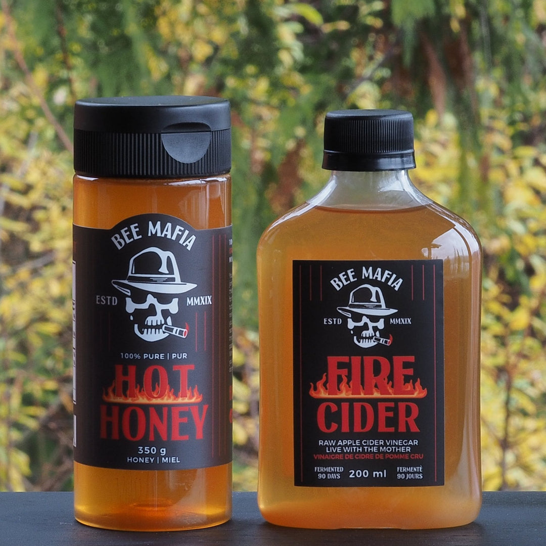 Combination of a small 350 gram honey bottle with Bee Mafia fire cider bottle. All produced in Canada.