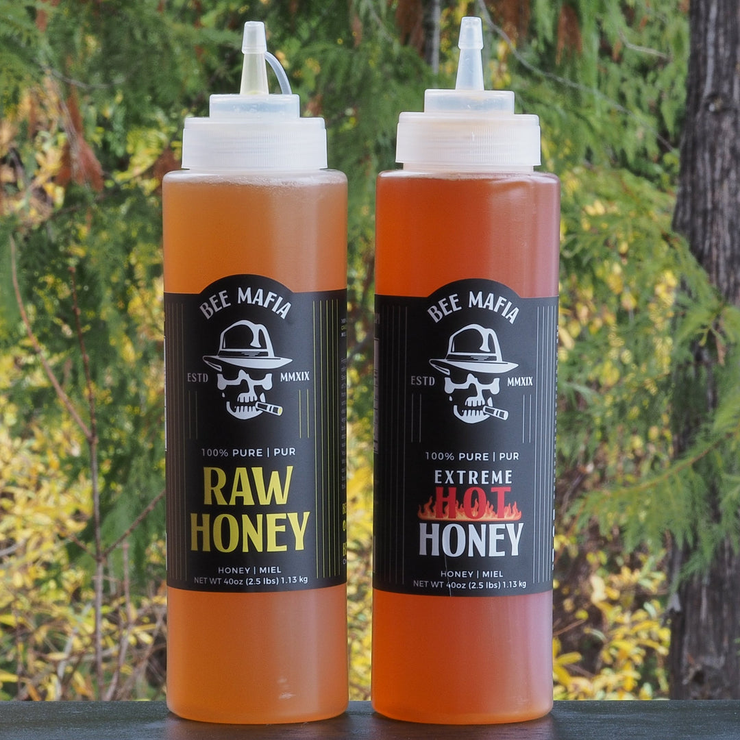 Combination pack of 40 oz chef bottles of Raw Bee Mafia Honey & Extreme Hot Honey infused products of Canada.